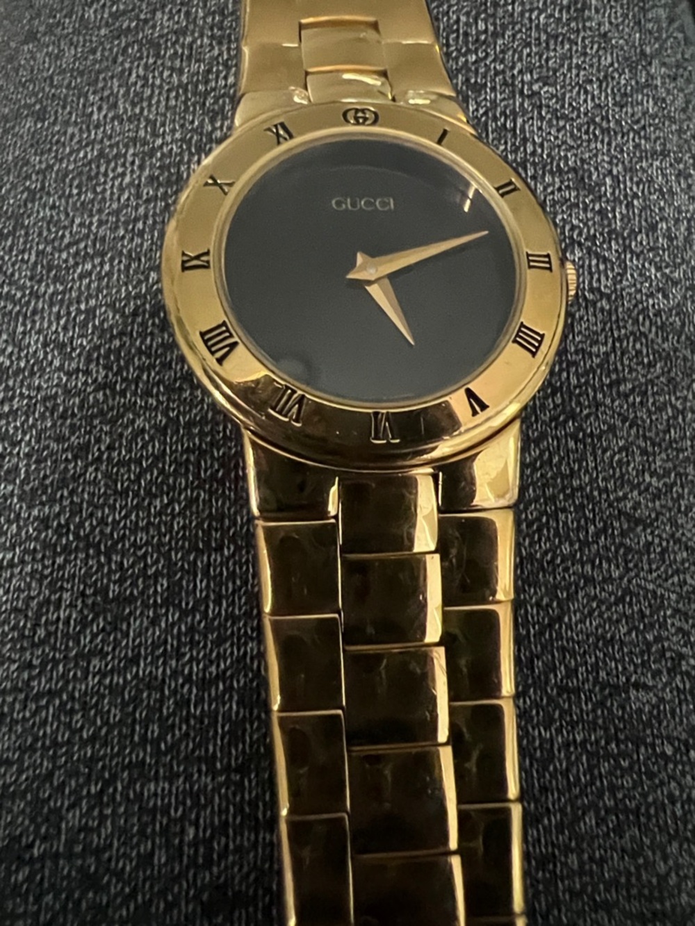 Gucci Gold and Black Roman Numeral Bracelet Watch